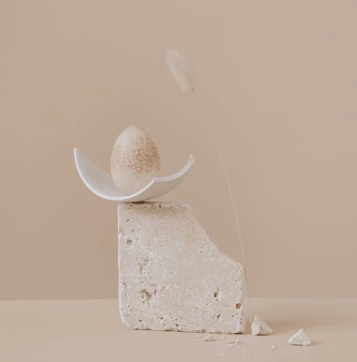 Abstract egg balancing on stone